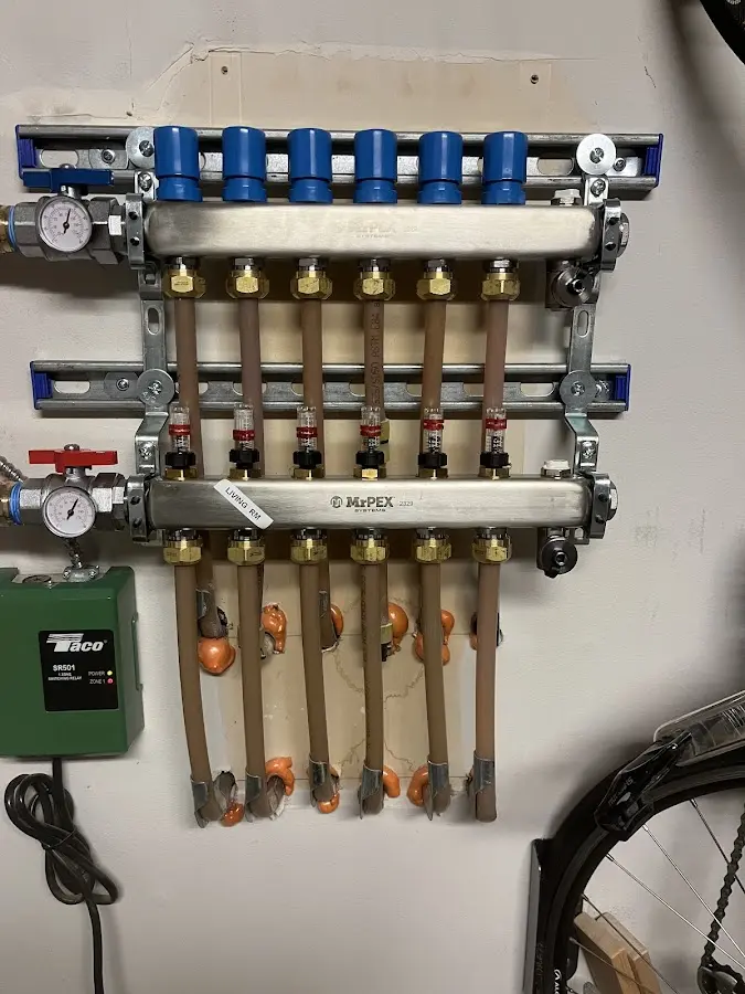 Plumber performing Water Heater Repair at a residential property in Conewago